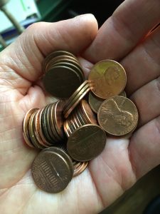 A fistful of pennies, one for every thought!